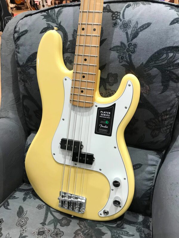 guitare basse jaune et blanche